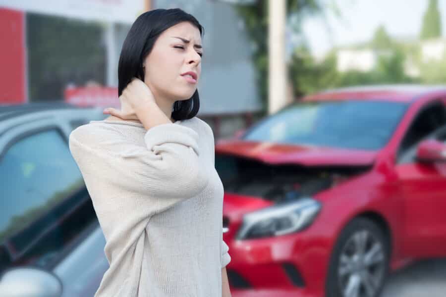 Woman Holding Neck After a Car Accident